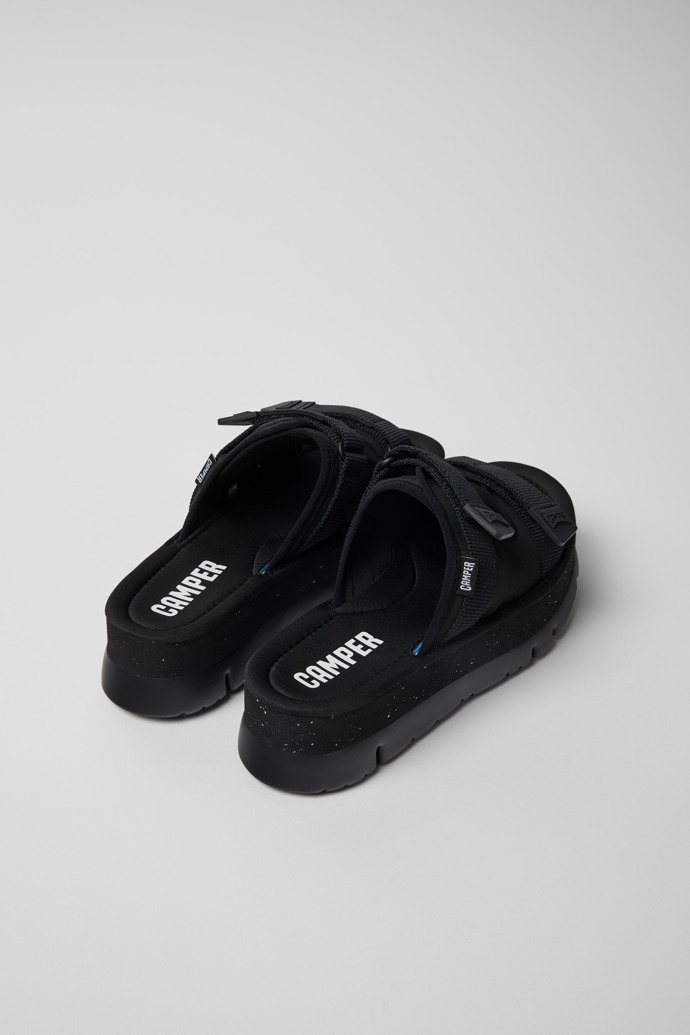 Camper Oruga Up - Mules negros de tela para mujer.
